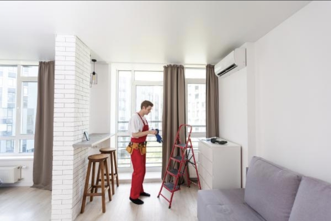 Maintenance technician servicing an apartment unit for a DoryAngel property
